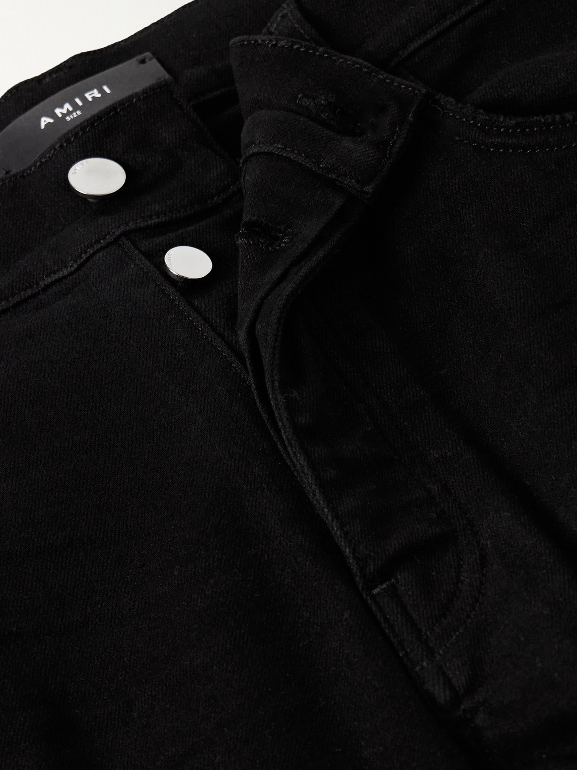 Amiri Mx1 Skinny-fit Leather-panelled Distressed Jeans In Black