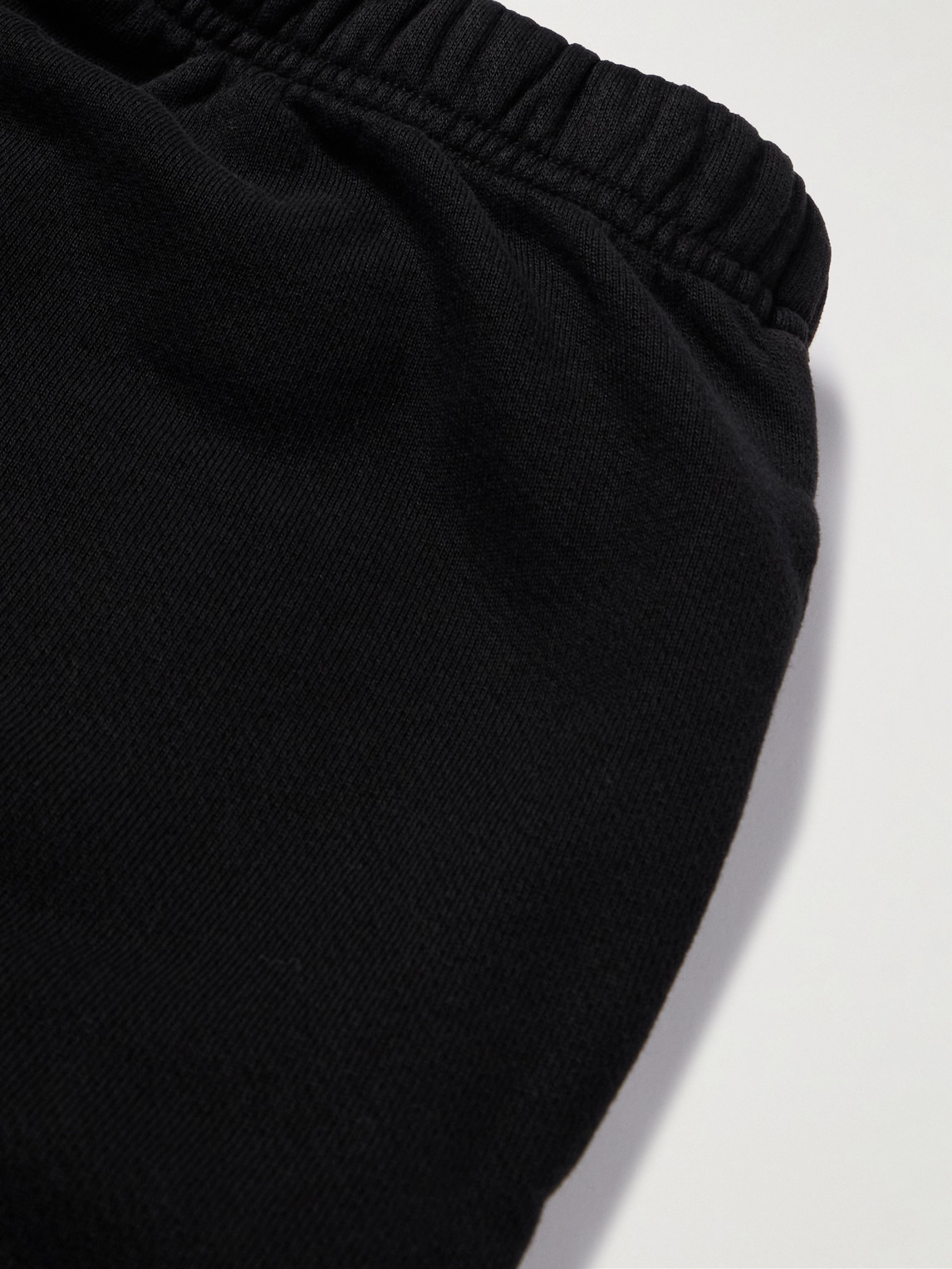 Shop Les Tien Tapered Garment-dyed Cotton-jersey Sweatpants In Black