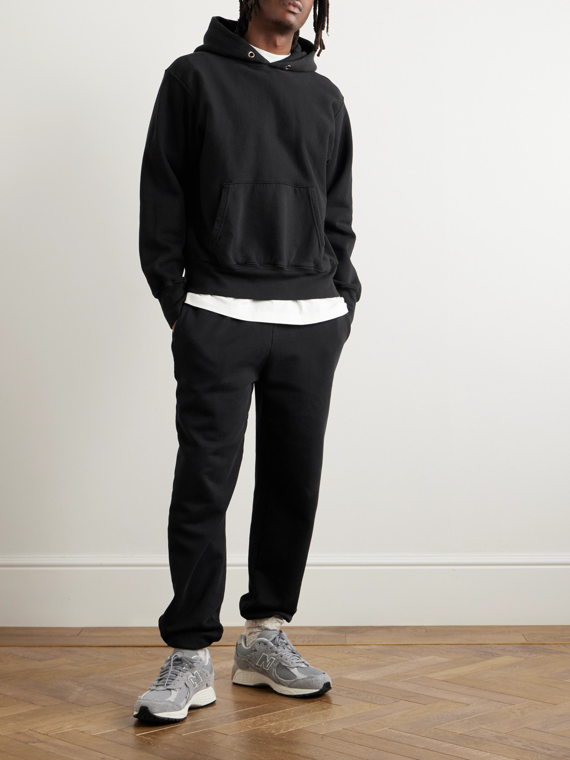 Shop Les Tien Tapered Garment-dyed Cotton-jersey Sweatpants In Black